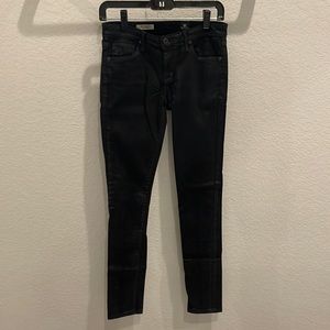 Black coated AG skinny legging jean